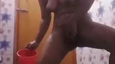 Bhabhi in bathroom baths and fingers cunt in horny mood