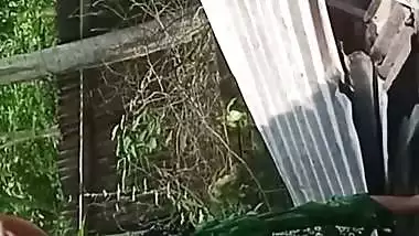 Village neighbor girl outdoor bath caught through hole